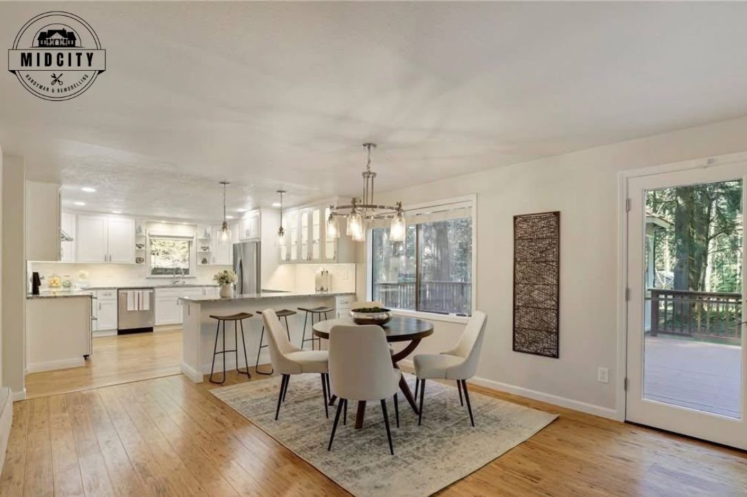 Open concept kitchen and dining space after a full renovation by Midcity Handyman & Remodeling